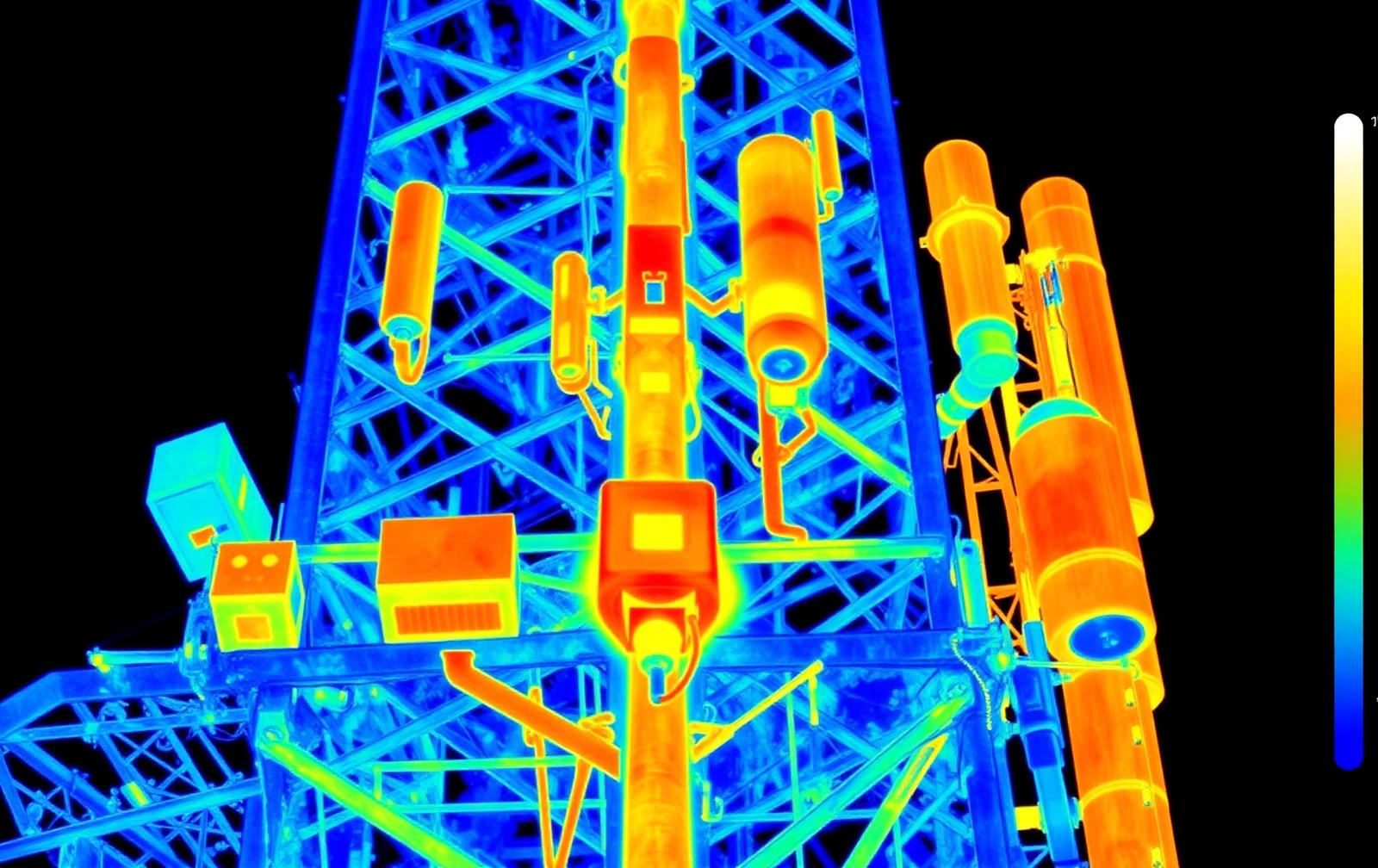 Thermal imaging view of telecommunications tower equipment showing heat signatures